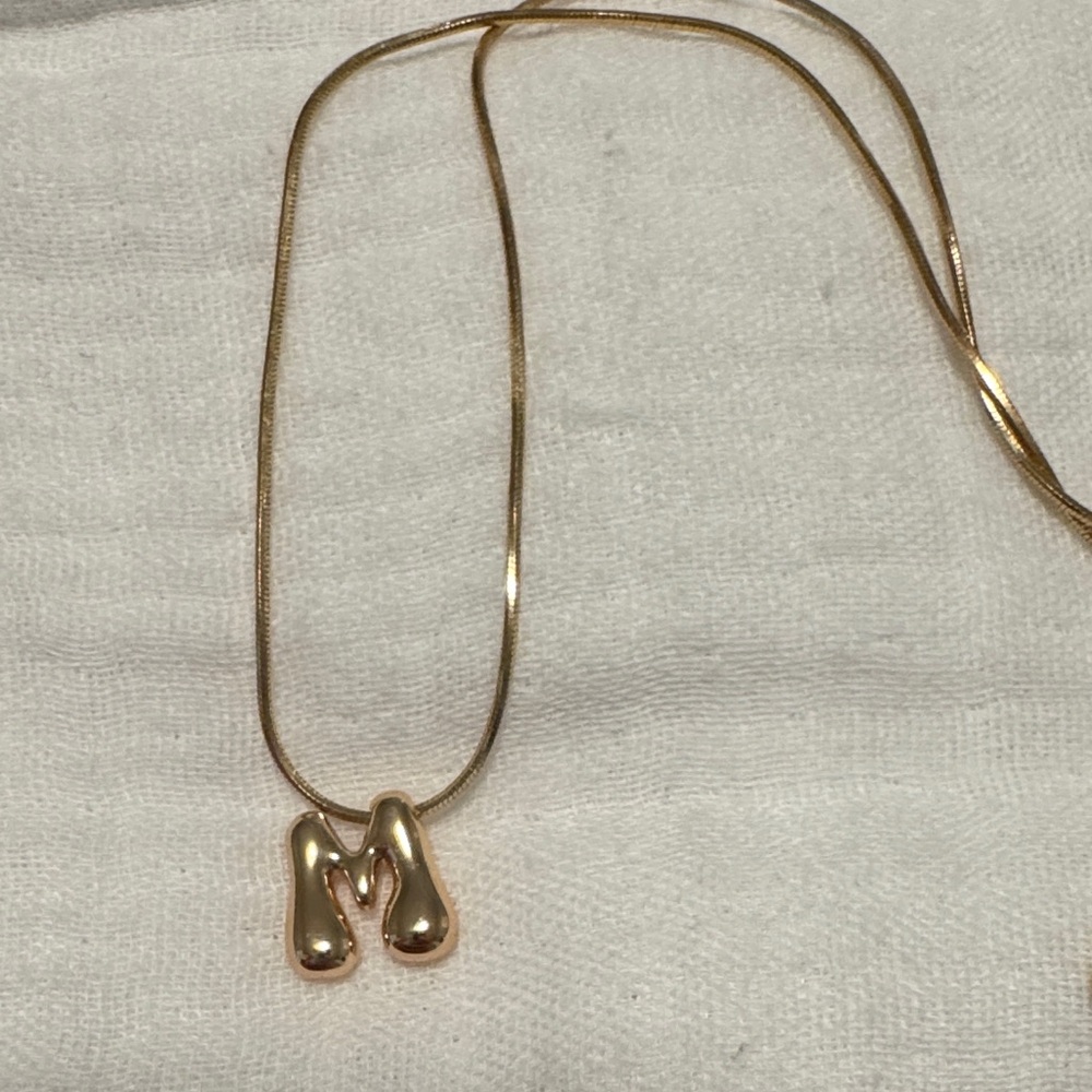 Anthropologie. Gold bubble monogram M necklace.